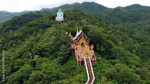 Aerial view of the Great Buddha statue of Wat Doi Phra Chan at the Buddhist temple in Thailand