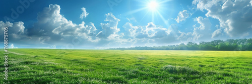 Beautiful spring nature with a neatly trimmed lawn surrounded by trees against a blue sky background with clouds on a bright sunny day.banner.Beautiful summer natural landscape spring grass 