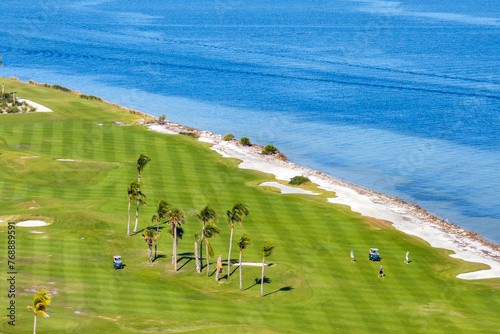 Big golf course field with green grass in Boca Grande, small town on Gasparilla Island in southwest Florida