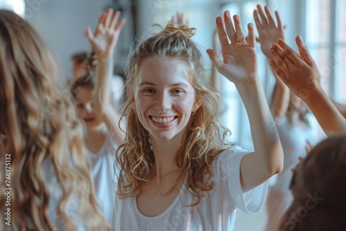 Happy female choreographer rejoicing the success of her students girls in dance training. Friendly woman teacher giving high five to her kids at the end of class in choreography, Generative AI