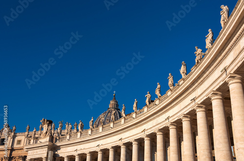 the right side of the colonnade of Saint Peter square populated with baroque statues