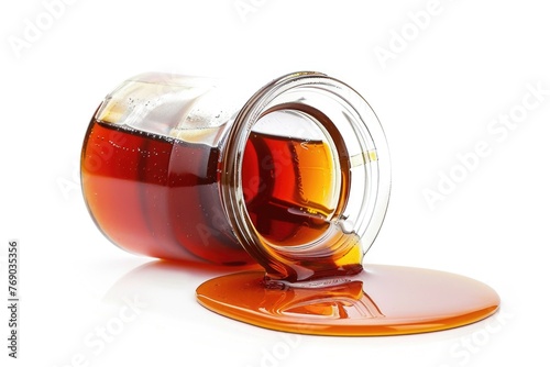 Spilled maple syrup on white background