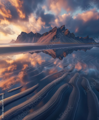 Vestrahorn mountaine on Stokksnes cape in Iceland during sunset with reflection.