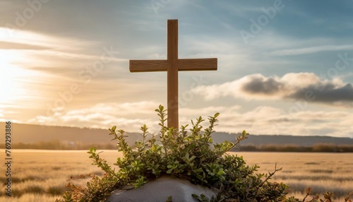 wooden cross with sprigs of boxwood easter symbol of life and immortality concept