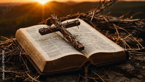 A powerful image showing a Christian cross laying upon an open Bible during the golden hour of sunset