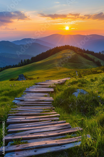 A wooden path through beautiful green hills during sunset