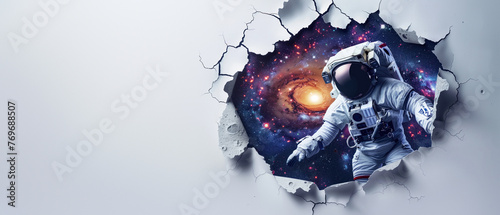 An astronaut seems to be entering into a galactic universe scene through a torn white wall, representing adventure