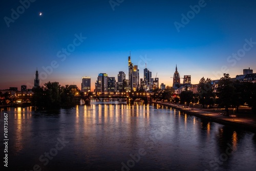 Aerial view of a vibrant cityscape of Frankfurt am main illuminated against the night sky