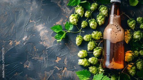 A cluster of hops next to a bottle of craft beer, brewer's choice