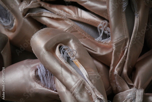 Photo of many pairs of ballet point shoes