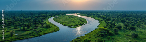 Landscape drone view of a river delta with lush green vegetation and winding waterways