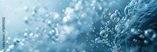 Close-up of underwater bubbles in blue - A serene underwater scene with myriad bubbles ascending towards the shimmering surface light
