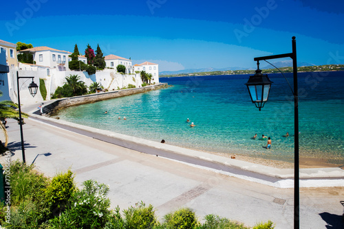 Amazing View on Spetses - one of fantastic of Greek islands and outdoors chairs and umbrellas of white and blue color