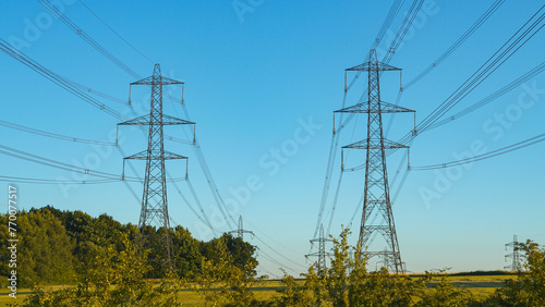 High voltage transmission line near a power station in the English countryside