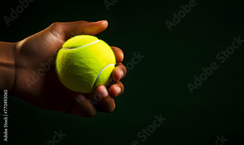 Close-up of a tennis ball in the hands of a man
