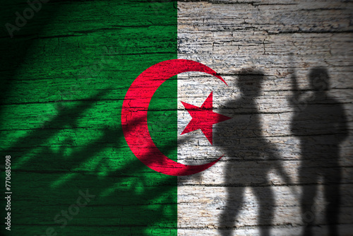 Algeria flag on wood and soldiers shadow