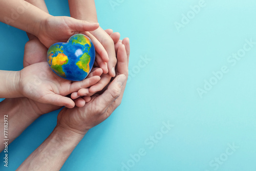 hands holding globe earth day