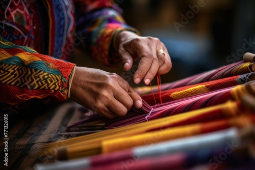 Close-up of hands weaving a traditional textile on a wooden loom
