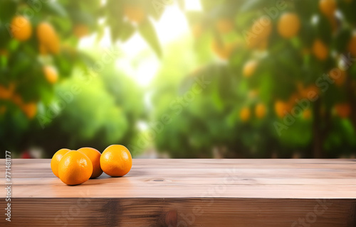 orange fruit on wooden table on blurred nature citrus trees gard