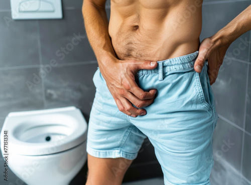 A visual representation of the challenges faced by a middle-aged man suffering from cystitis, evident from his pained expression and the gesture of clutching his lower abdomen