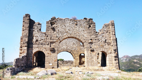 Aqueduct and basilicas behind the historical Aspendos Ancient Theater in Antalya, Turkey