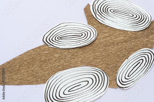 crepe paper shape and cut paper ovals with spiral designs