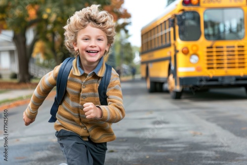 small happy boy run in front of school bus