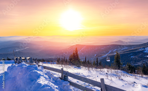 Landscape snowy forest on mountain ski lift resort in winter sunset light, Sheregesh, Kemerovo region Russia
