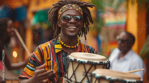 African street musician in colorful clothing on drums.