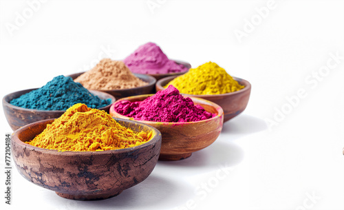 Powder Colors in Bowls on a White Background. A row of bowls filled with different colored powders. The bowls with each bowl containing a different color of powder. colors range from light to dark.