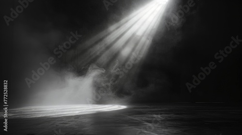 Ray of scenic spot light over black smoky background, square stage illumination background photo