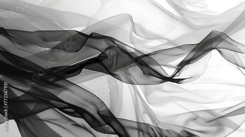 Fluttering chiffon and organza fabric in black and white. Translucent textiles with delicate movement.