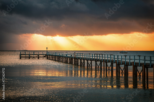 The view of the Sorrento Long Pier in Mornington Peninsula in Melbourne under the sunbeam at dawn 