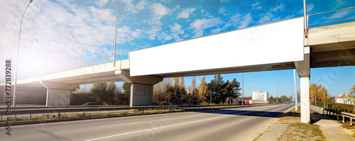 Blank billboard serves as invitation to advertisers on bridge. Beacon for future companies capturing attention of passersby and travelers.