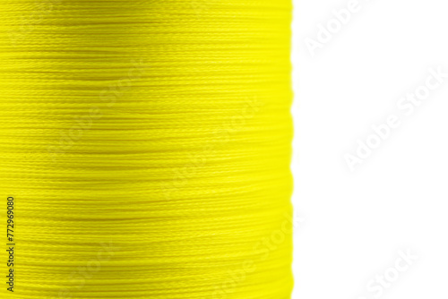 Yellow fishing braided line close up. Spool of green cord isolated. Spool of braided fishing line