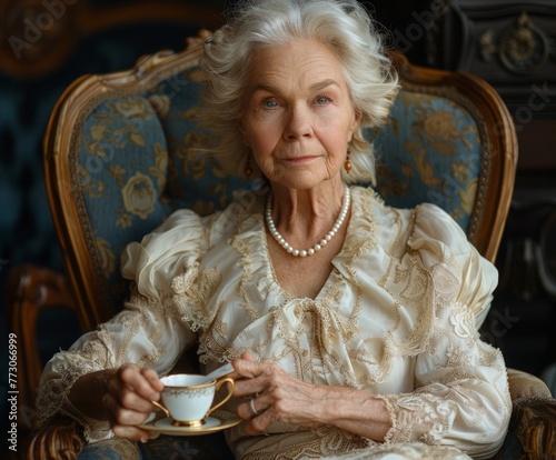 Snobbish elegant old lady having a cup of tea