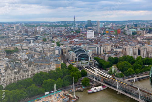 Charing Cross Station, Hungerford Bridge and Golden Jubilee Bridge aerial view over River Thames in London, England, UK. 