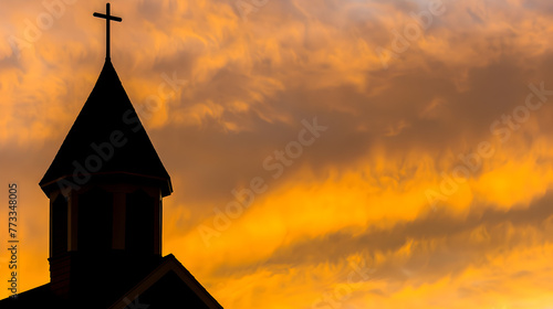 A tranquil photograph of a church steeple against a vibrant sunset sky, evoking a sense of spiritual peace