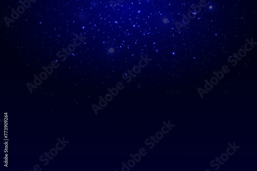 Space background with shining stars. Night effect of dust particles and light glare. A flash of the starry sky.