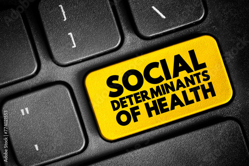 Social determinants of health - economic and social conditions that influence individual and group differences in health status, text concept button on keyboard