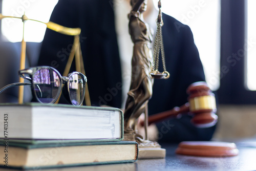 judge holds givel wood tapped on the wooden base to read verdict for victims and defendants to know the verdict obtained from the evidence and the lawyer's defense of the case. court decision concept