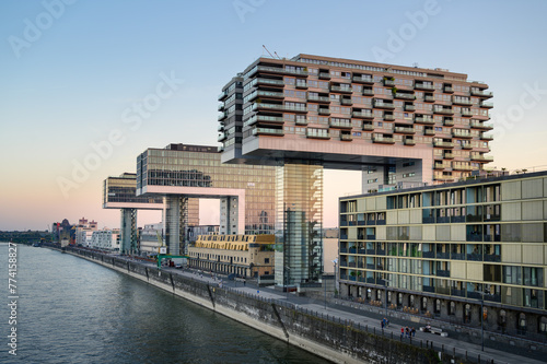 Promenade at the Rhine Harbor in Cologne, Germany: Modern apartment and office buildings line the formal industrial harbor