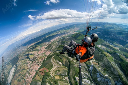 Paragliding in the sky, flying over the landscape and mountains, extreme sport