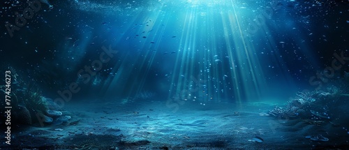  A deep blue sea scene beneath, sunlit waters streaming above, fish swimming at the ocean floor