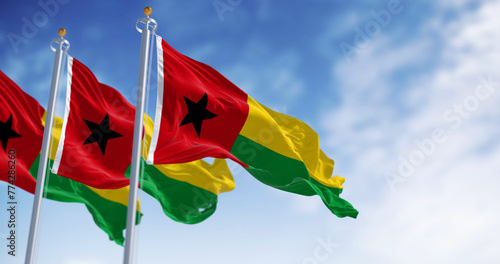 National flags of Guinea-Bissau waving in the wind on a clear day