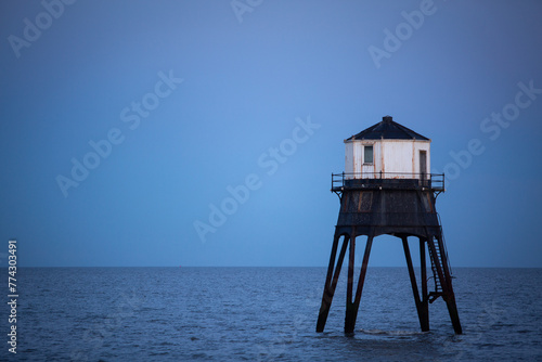 Lighthouse in the sea, Dovercourt low lighthouse at high tide built in 1863 and discontinued in 1917 and restored in 1980 the 8 meter lighthouse is still a iconic sight after sunset