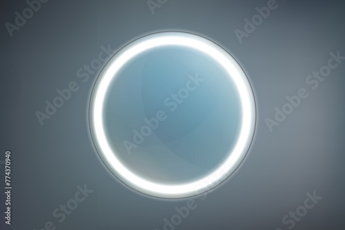 Round bathroom or vanity mirror with white LED backlit on a dark background