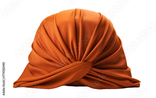 An orange turban rests gracefully on a white background