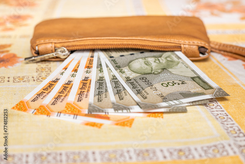 Women's purse with Indian rupees, Financial concept, India money, The highest denominations of 200 and 500 rupees