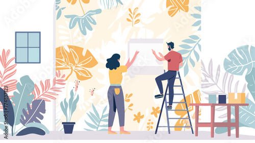 Woman applying glue onto wallpaper while man hanging